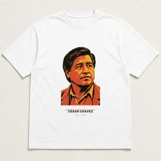 Front of a white tee carrying the civic modern Cesar Chavez design